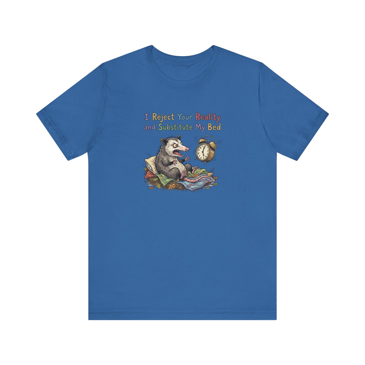 Blue t-shirt with possum in bed and text "I Reject Your Reality and Substitute My Bed".