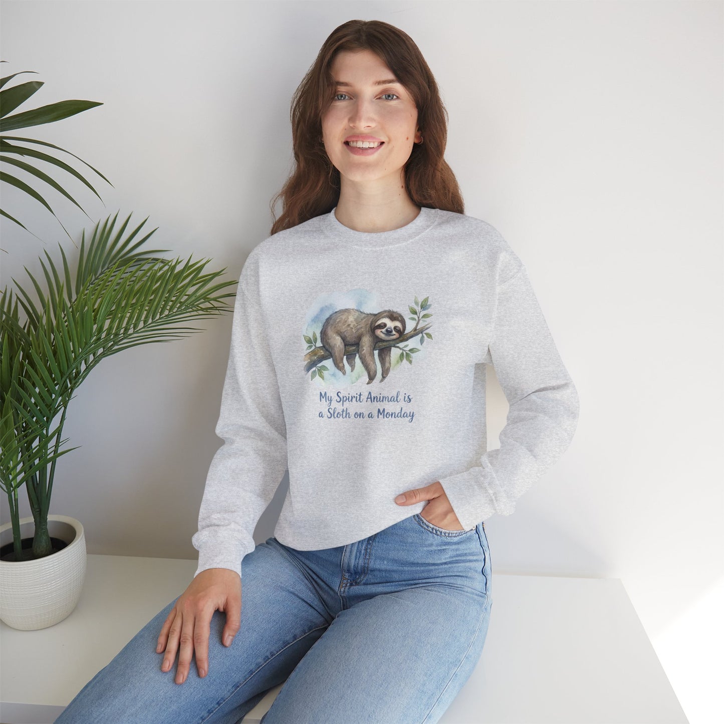 Grey sweatshirt with "My Spirit Animal is a Sloth on a Monday" text.