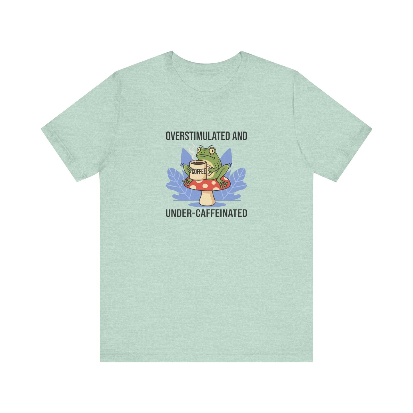 Mint green t-shirt with a frog on a mushroom holding a "COFFEE" cup.