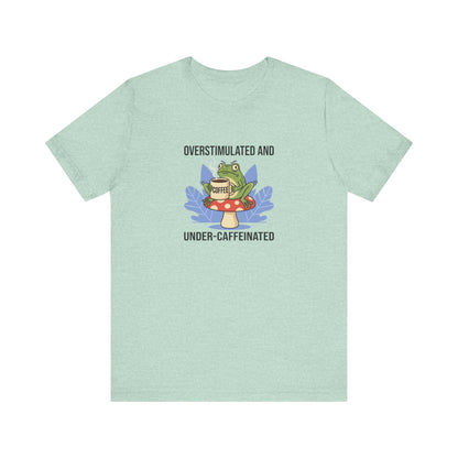 Mint green t-shirt with a frog on a mushroom holding a "COFFEE" cup.