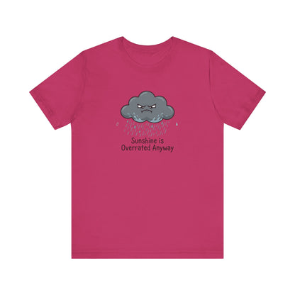 Pink t-shirt with a cartoon angry cloud raining, saying "Sunshine is Overrated Anyway".