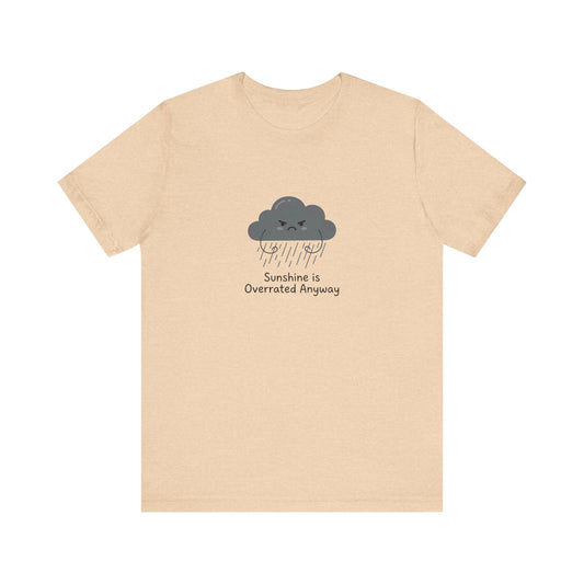 Light peach t-shirt with a cartoon cloud graphic saying "Sunshine is Overrated Anyway".
